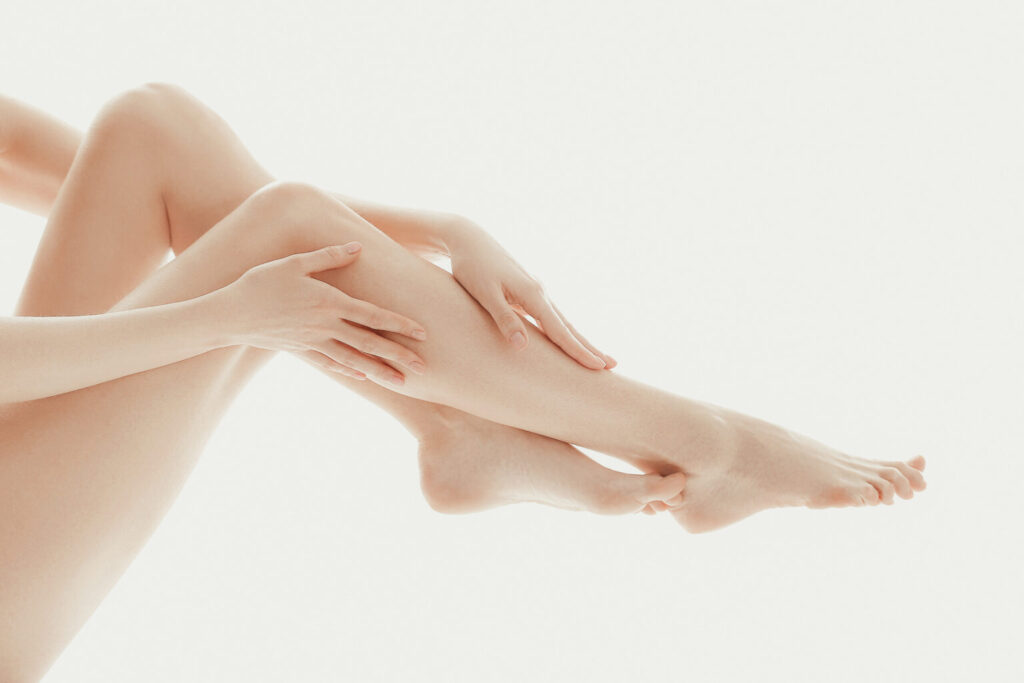 person-touching-her-legs-with-her-fingers-1536x1024